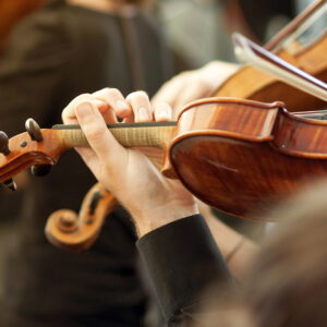 Image of musicians playing violins.