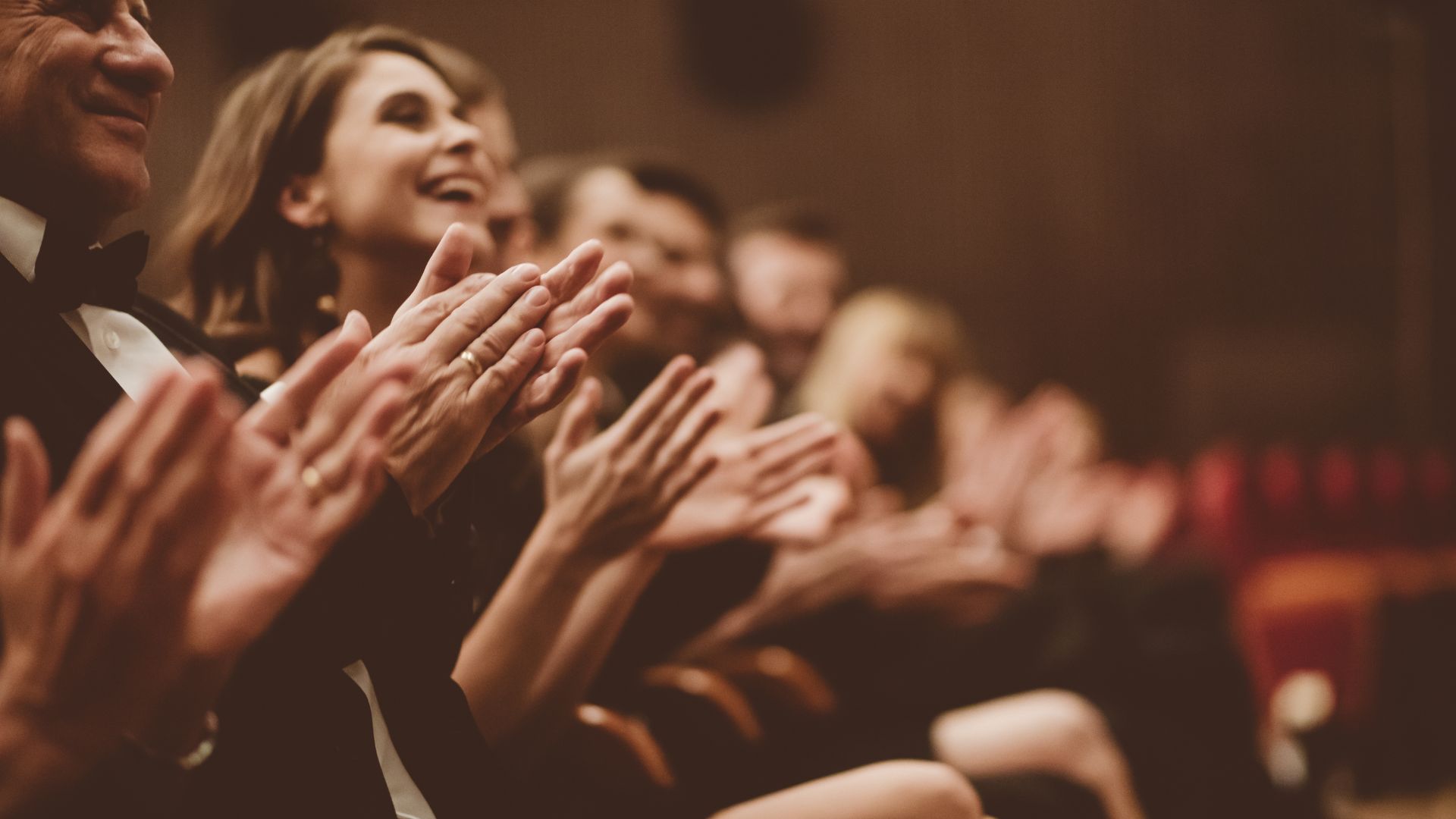 people enjoying an event at a theater